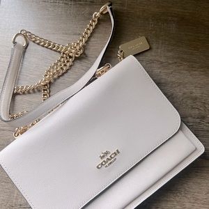 Cream Coach crossbody purse
